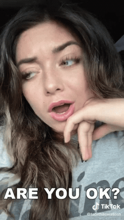 A Woman With Her Mouth Open And The Words Are You Ok Written Above Her GIF