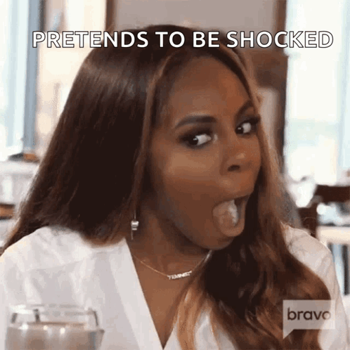 A Woman With Her Mouth Open And The Words Pretends To Be Shocked Written Above Her GIF