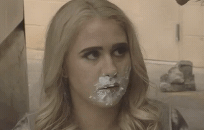 A Woman With Icing On Her Face Says I Ate The Baby GIF