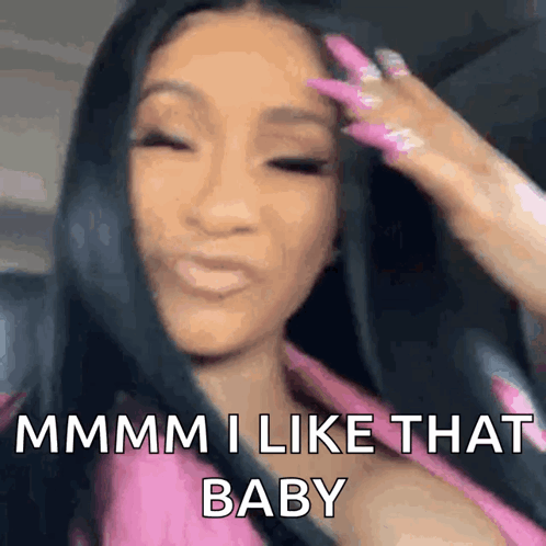A Woman With Long Black Hair And Pink Nails Is Sitting In A Car And Making A Funny Face . GIF
