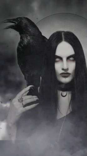 A Woman With Long Black Hair Is Holding A Black Crow On Her Shoulder GIF