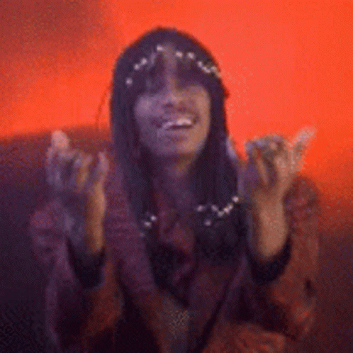 Woman With Long Black Hair Smiling And Raising Hands GIF