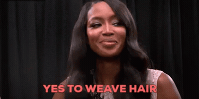 A Woman With Long Black Hair Is Smiling And Saying Yes To Weave Hair . GIF