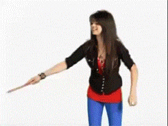 A Woman With Long Black Hair Is Smiling In Front Of A Green Circle GIF
