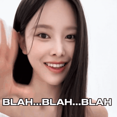 A Woman With Long Black Hair Is Smiling With Blah Blah Blah Written Below Her GIF