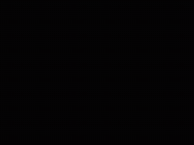 A Woman With Long Black Hair Is Standing In A Dark Room And Looking At The Camera . GIF