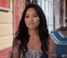 Woman With Long Black Hair In Front Of Building GIF