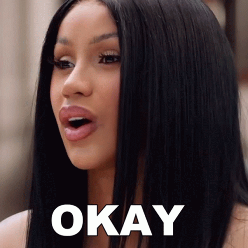 A Woman With Long Black Hair Says Okay GIF