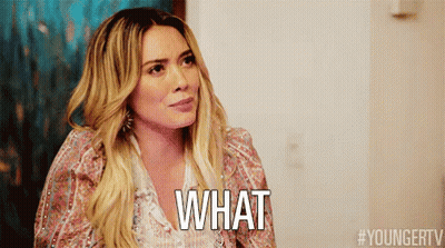 A Woman With Long Blonde Hair Is Asking What GIF
