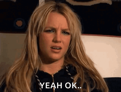 A Woman With Long Blonde Hair Is Making A Funny Face And Saying Yeah Ok . GIF