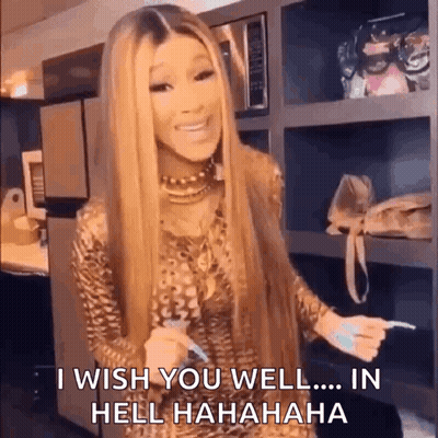 A Woman With Long Blonde Hair Is Standing In A Kitchen Holding A Toothbrush And Saying I Wish You Well In Hell . GIF