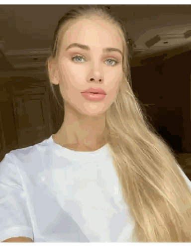 A Woman With Long Blonde Hair Wearing A White Shirt Sticker