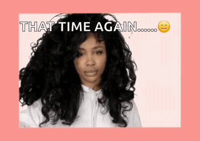 A Woman With Long Curly Hair Is Wearing A White Hoodie And Says That Time Again . GIF