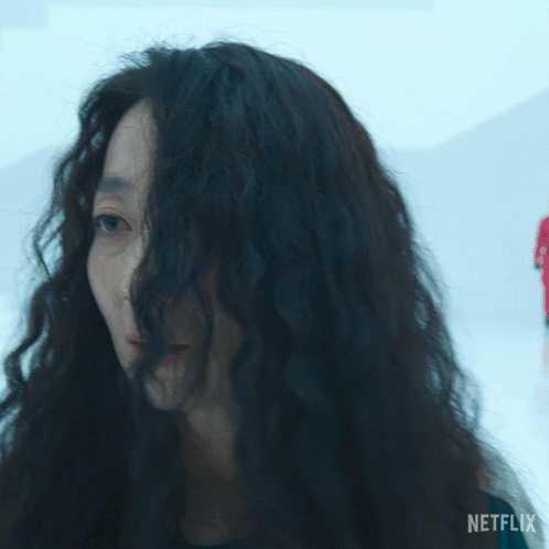 A Woman With Long Dark Hair Is Asking Where Is Everyone GIF