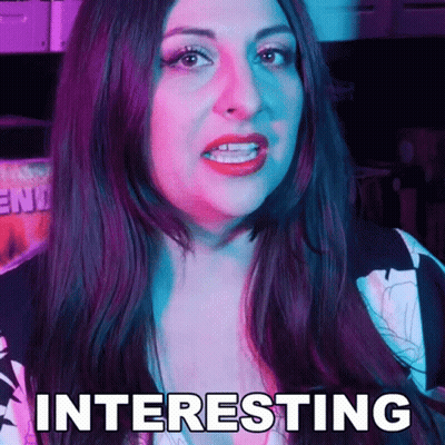 A Woman With Long Dark Hair Is Making A Funny Face And The Word Interesting Is On Her Face . GIF