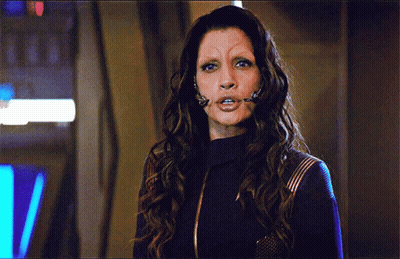 A Woman With Long Hair And A Fake Eyebrow GIF