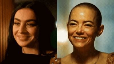 A Woman With Long Hair And A Woman With Shaved Hair GIF