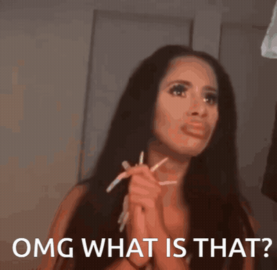 A Woman With Long Hair Is Holding A Pair Of Pencils In Her Hands And Says Omg What Is That GIF