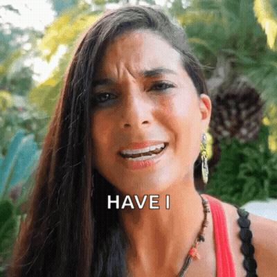 A Woman With Long Hair Is Making A Funny Face And The Words Have I Are On Her Face GIF