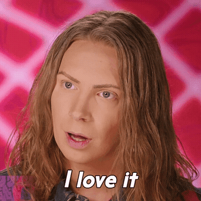 A Woman With Long Hair Is Saying I Love It GIF
