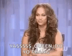 A Woman With Long Hair Is Sitting In A Chair With Her Arms Crossed And Saying Yassss Queen Do Yo Thang . GIF