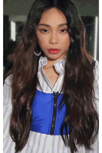 A Woman With Long Hair Is Wearing A Blue Vest Sticker