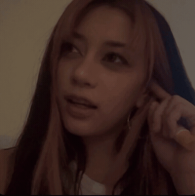 A Woman With Long Hair Making A Funny Face GIF