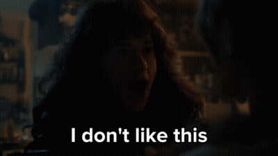 A Woman With Long Hair Says I Don 'T Like This In A Dark Room GIF