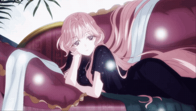 A Woman With Long Pink Hair Is Laying On A Couch GIF