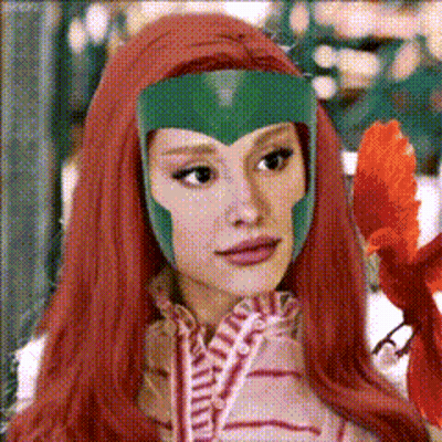 A Woman With Long Red Hair And A Green Helmet On Her Head GIF