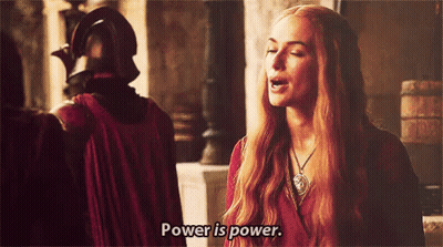 A Woman With Long Red Hair Is Saying Power Is Power GIF