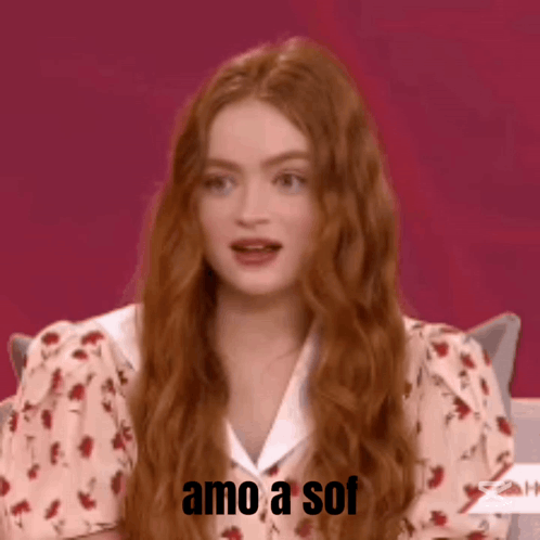A Woman With Long Red Hair Is Smiling With The Words Amo A Sof Written Below Her GIF
