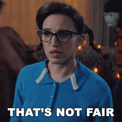 A Woman With Pigtails And Glasses Has The Words That 'S Not Fair Above Her GIF
