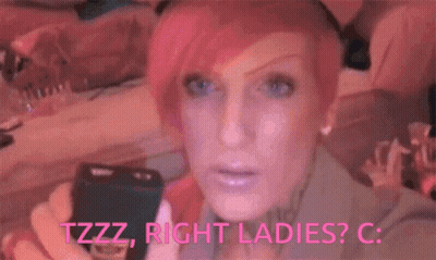 A Woman With Pink Hair And Blue Eyes Is Holding A Flashlight And Says Tzzz Right Ladies C. GIF