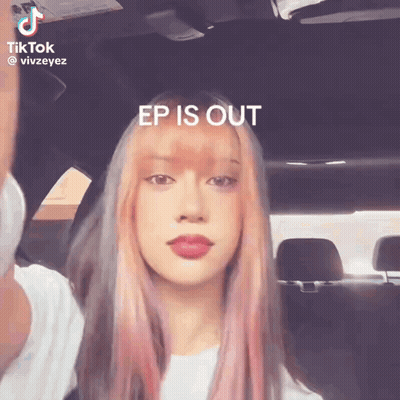A Woman With Pink Hair Is Sitting In A Car With The Words Ep Is Out Above Her GIF