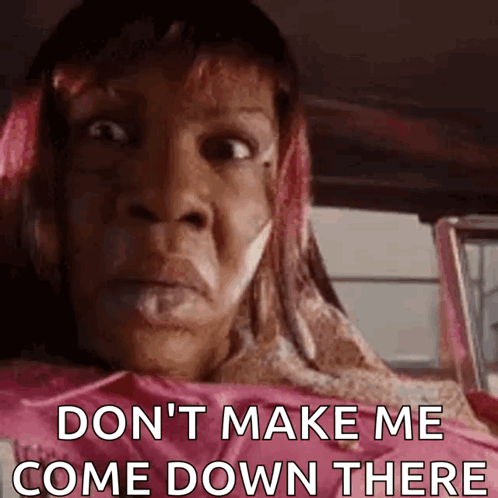 A Woman With Pink Hair Is Sitting In The Back Seat Of A Car And Says `` Don 'T Make Me Come Down There '' . GIF