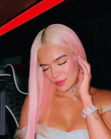 A Woman With Pink Hair Is Wearing A Choker And Bracelet GIF