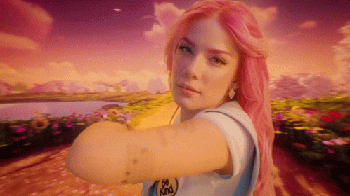 A Woman With Pink Hair Is Wearing A White Shirt That Says Be Kind GIF