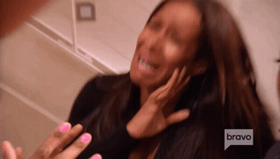 A Woman With Pink Nails Is Being Interviewed By A Man On Bravo GIF