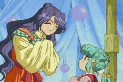 A Woman With Purple Hair And A Green Haired Girl Are Standing Next To Each Other GIF