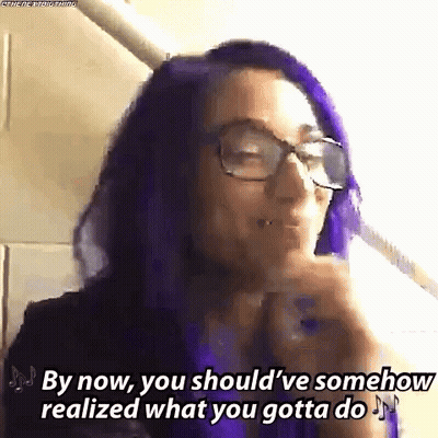 A Woman With Purple Hair And Glasses Says `` By Now , You Should Ve Somehow Realized What You Gotta Do '' . GIF