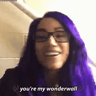 A Woman With Purple Hair And Glasses Says `` You 'Re My Wonderwall '' . GIF