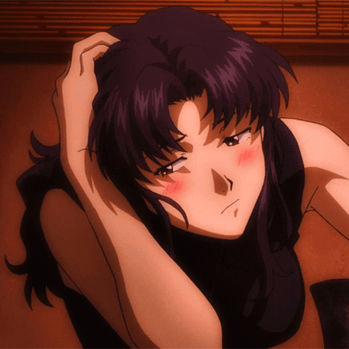 A Woman With Purple Hair Is Laying On The Floor With Her Hand On Her Head GIF