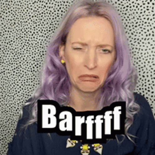A Woman With Purple Hair Is Making A Funny Face With The Word Barfff Written On It . GIF