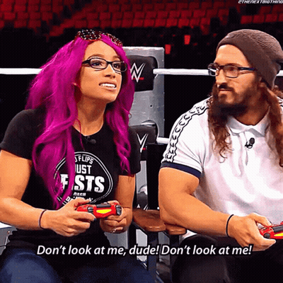 A Woman With Purple Hair Is Playing A Video Game While A Man Says Don 'T Look At Me Dude GIF