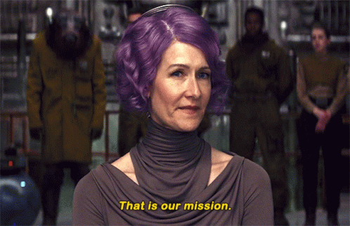 A Woman With Purple Hair Is Saying " That Is Our Mission " GIF