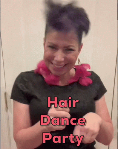 A Woman With Purple Hair Is Smiling And Wearing A Black Shirt That Says " Hair Dance Party " On It GIF