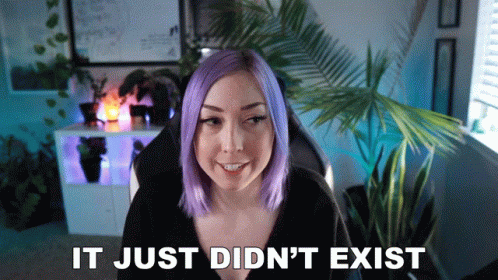 A Woman With Purple Hair Is Smiling In Front Of A Sign That Says It Just Didn 'T Exist GIF
