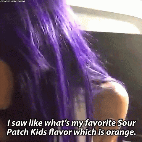 A Woman With Purple Hair Is Talking About Her Favorite Sour Patch Kids Flavor . GIF