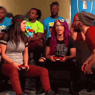 A Woman With Purple Hair Is Wearing A Black Shirt That Says Feel The Low GIF